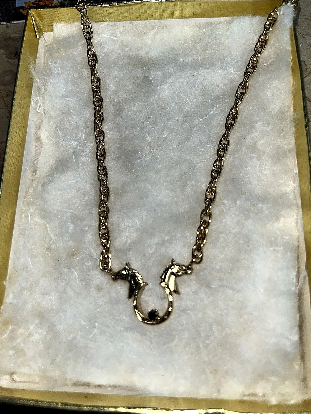 Gold-Tone Pendant Necklace with Horses and a real gem.